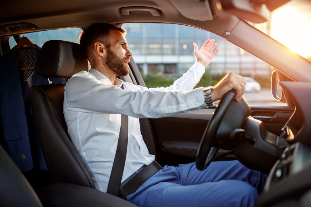 traffic jam - angry stressed businessman driving car